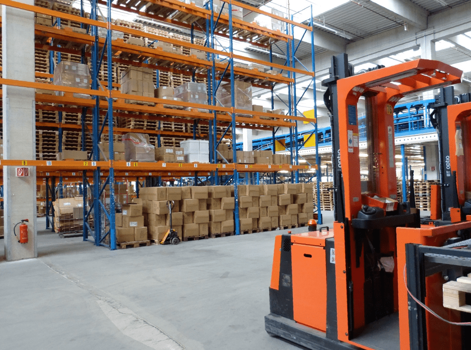 stand-up forklift in warehouse